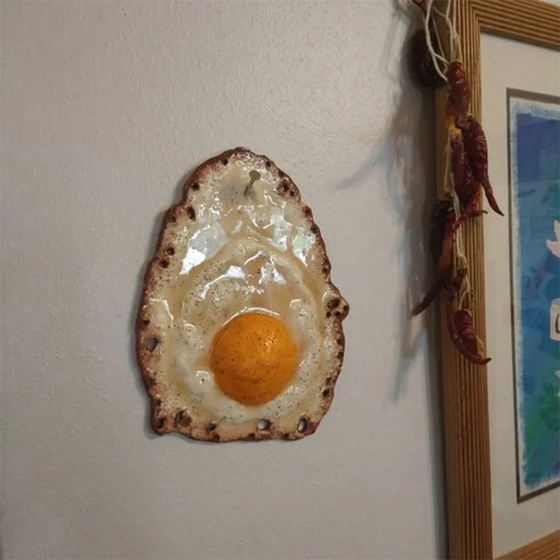 Fried Egg Hanging on a Nail